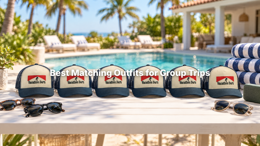 Matching Vacation Darts trucker hats lined up by a villa pool for a group trip
